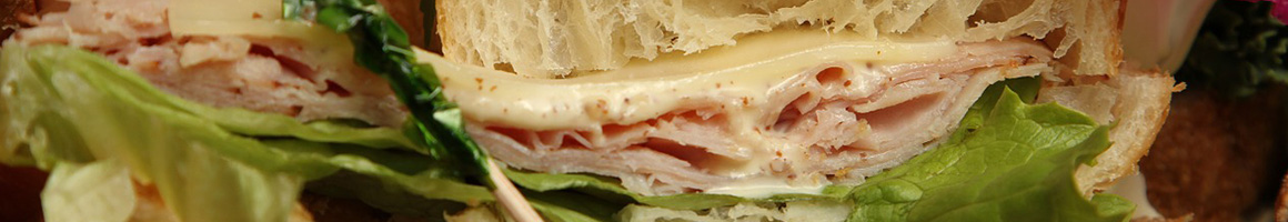 Eating Sandwich at Urbane Cafe restaurant in San Diego, CA.